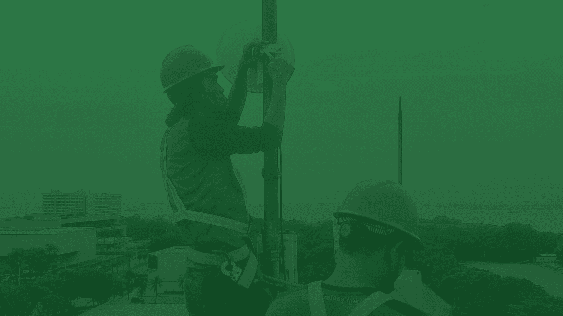 Wireless Link technicians installing network equipment